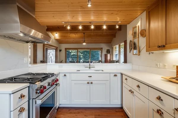 Design concept for a compact cabin kitchen with flat-panel wood cabinetry and open shelving, a direction suited to 1960s and 1970s Zephyr Cove cabins