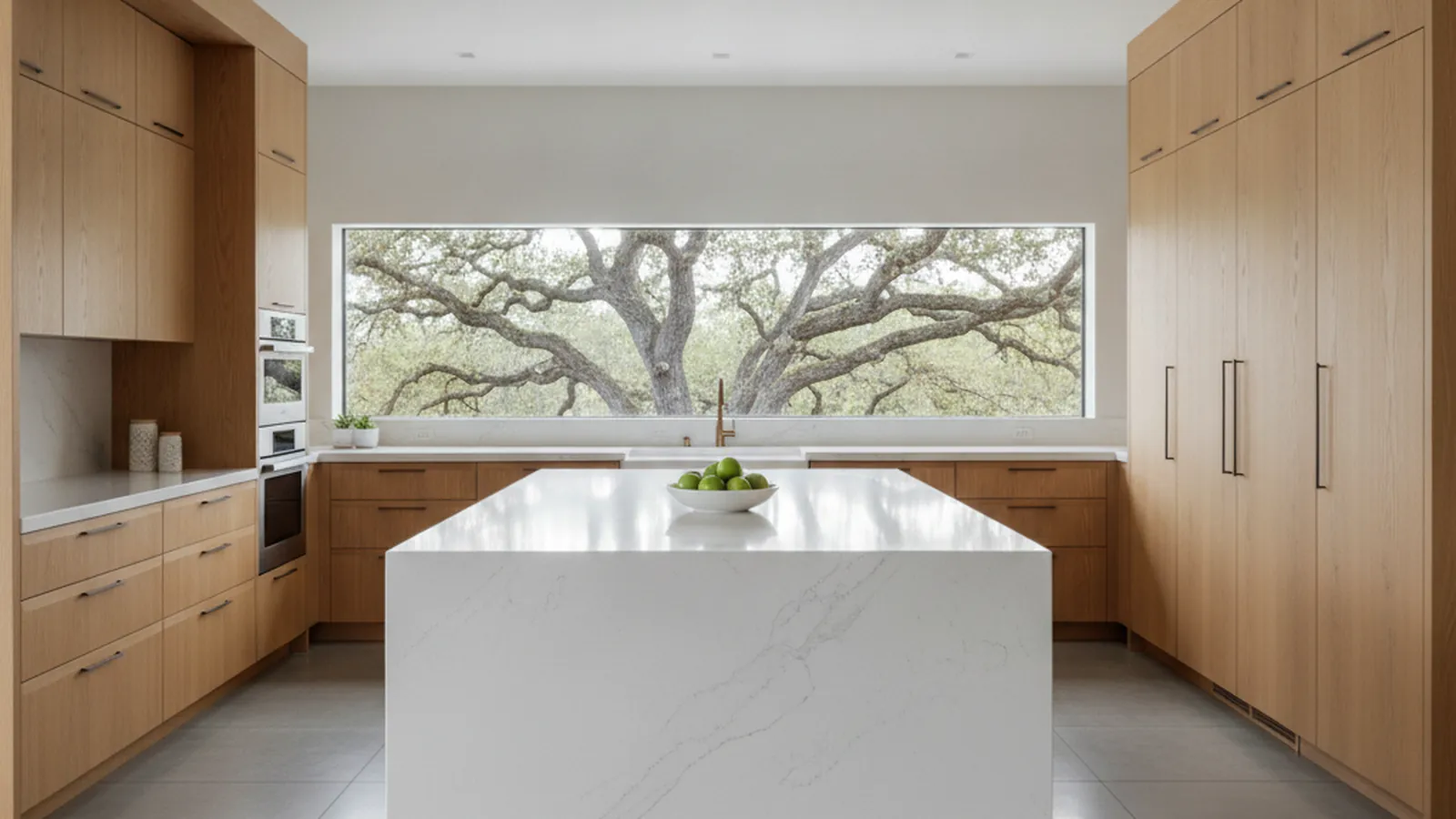 Design concept for a fully custom estate kitchen with a long furniture-style island, paneled range wall and butler’s pantry beyond, suited to a Granite Bay custom home